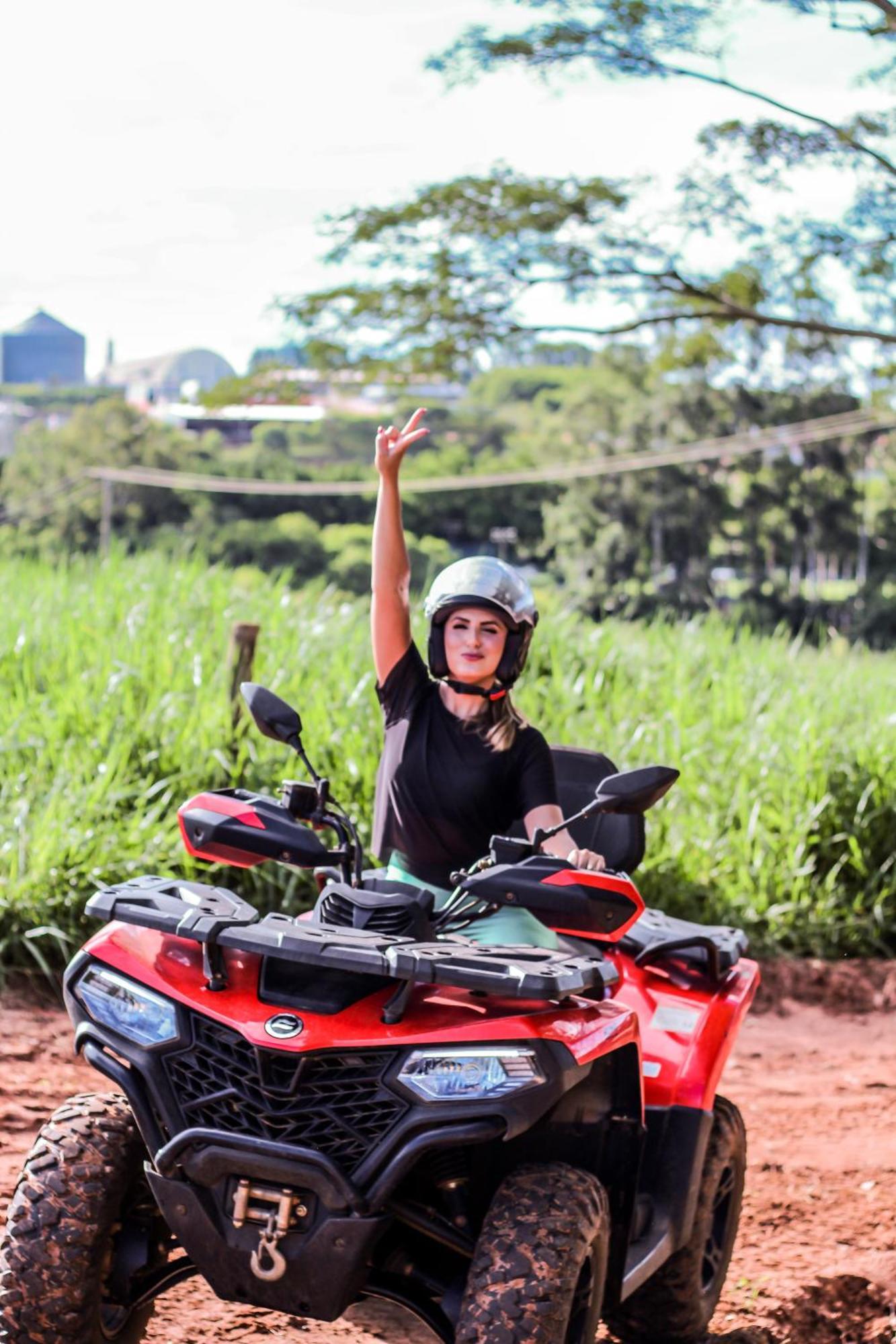 Blue Tree Thermas De Lins Resort Esterno foto A woman on a quad bike